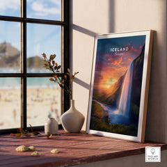 Iceland Poster | Icelandic Home Wall Art featuring a stunning waterfall and sunset in an elegant frame on a windowsill.