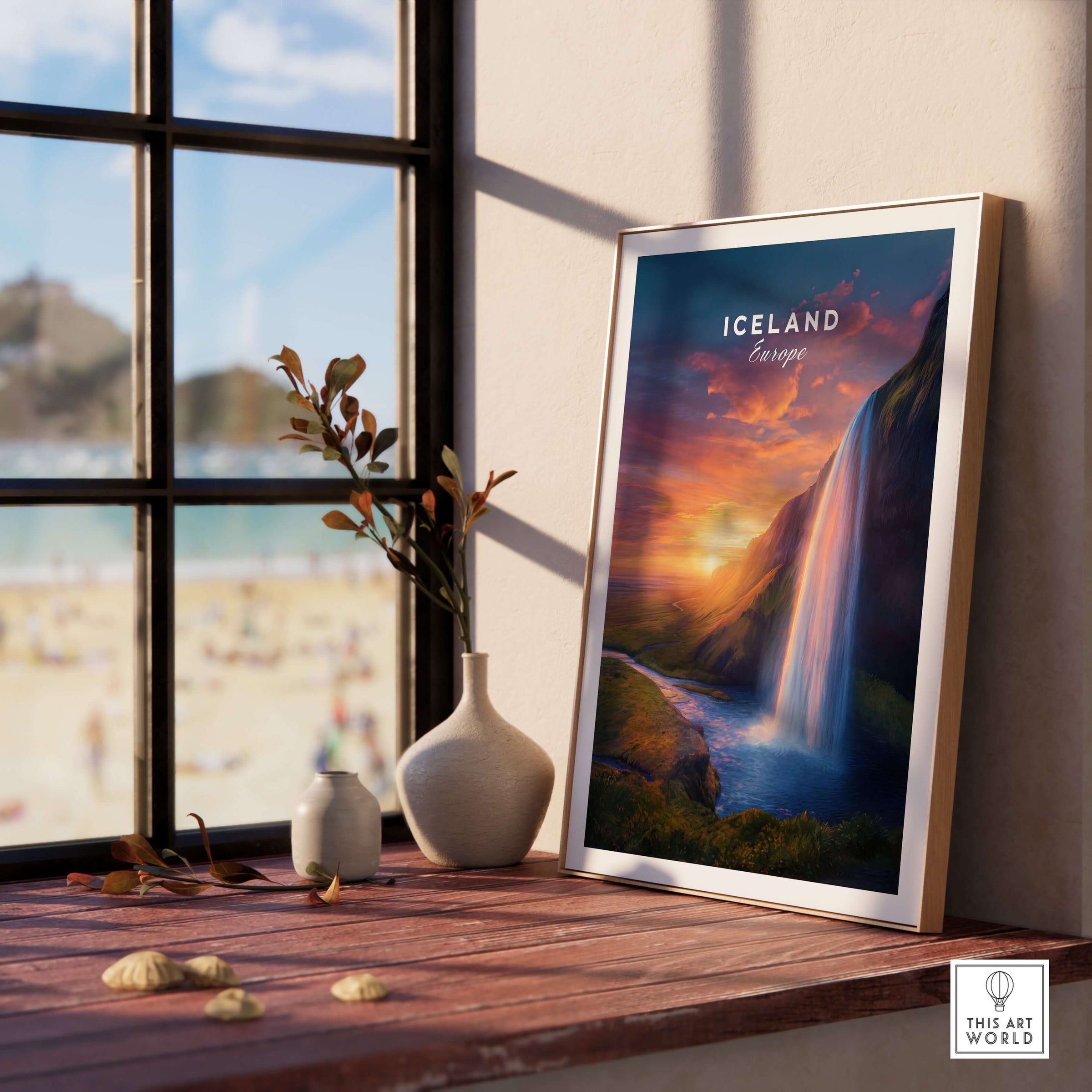 Iceland Poster | Icelandic Home Wall Art featuring a stunning waterfall and sunset in an elegant frame on a windowsill.