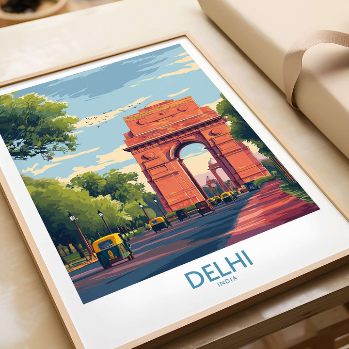 Vibrant cityscape poster of India Gate in Delhi with auto-rickshaws and lush greenery under a blue sky.