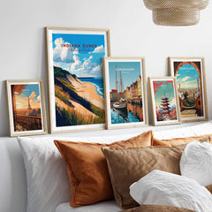 Indiana Dunes Wall Art displayed among other framed artwork on a stylish bed with cozy pillows.