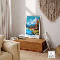 Interlaken Poster Switzerland displayed in a cozy living room, showcasing vibrant scenery and Swiss mountains.