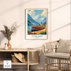 Interlaken Travel Poster showcasing a train amidst stunning Swiss landscapes in a cozy home setting.