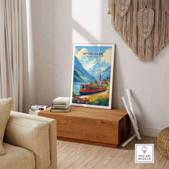 Interlaken Travel Print showcasing a scenic view with a train surrounded by mountains and greenery.