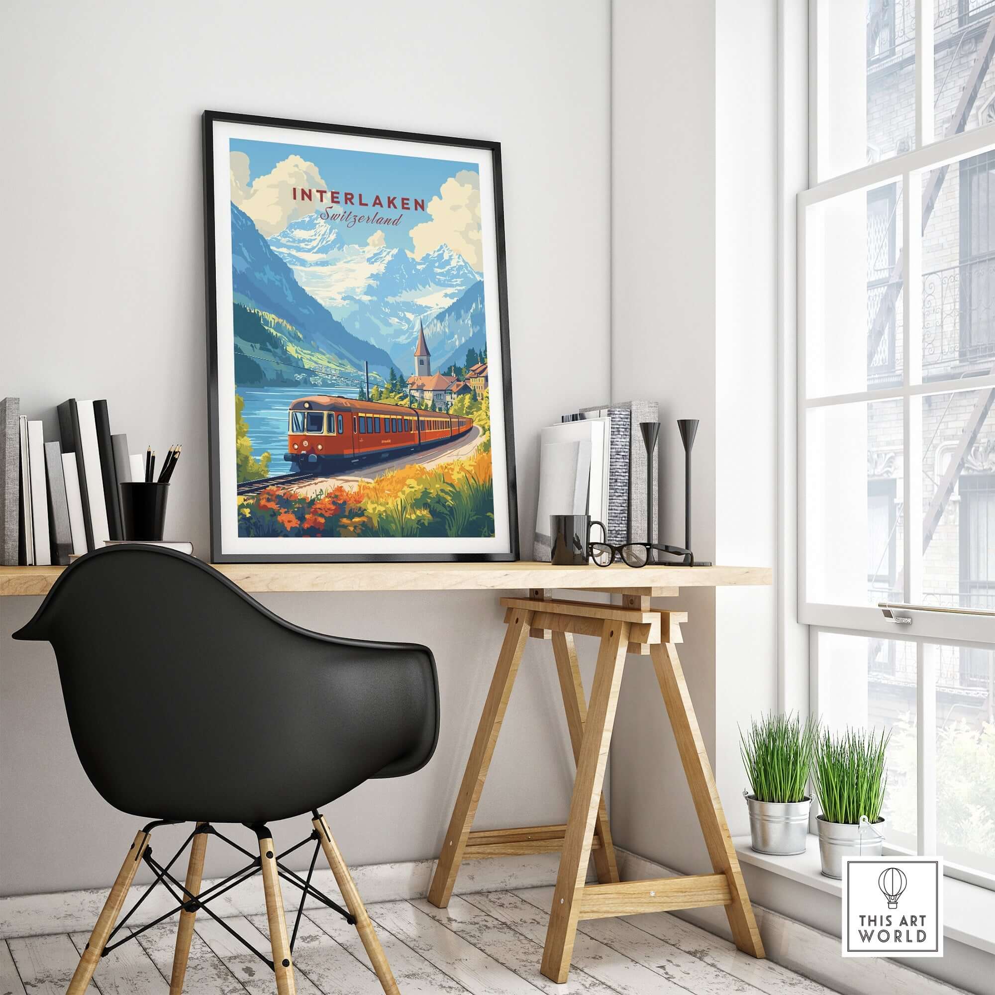 Interlaken Travel Print featuring a scenic train in a picturesque landscape on a stylish desk.