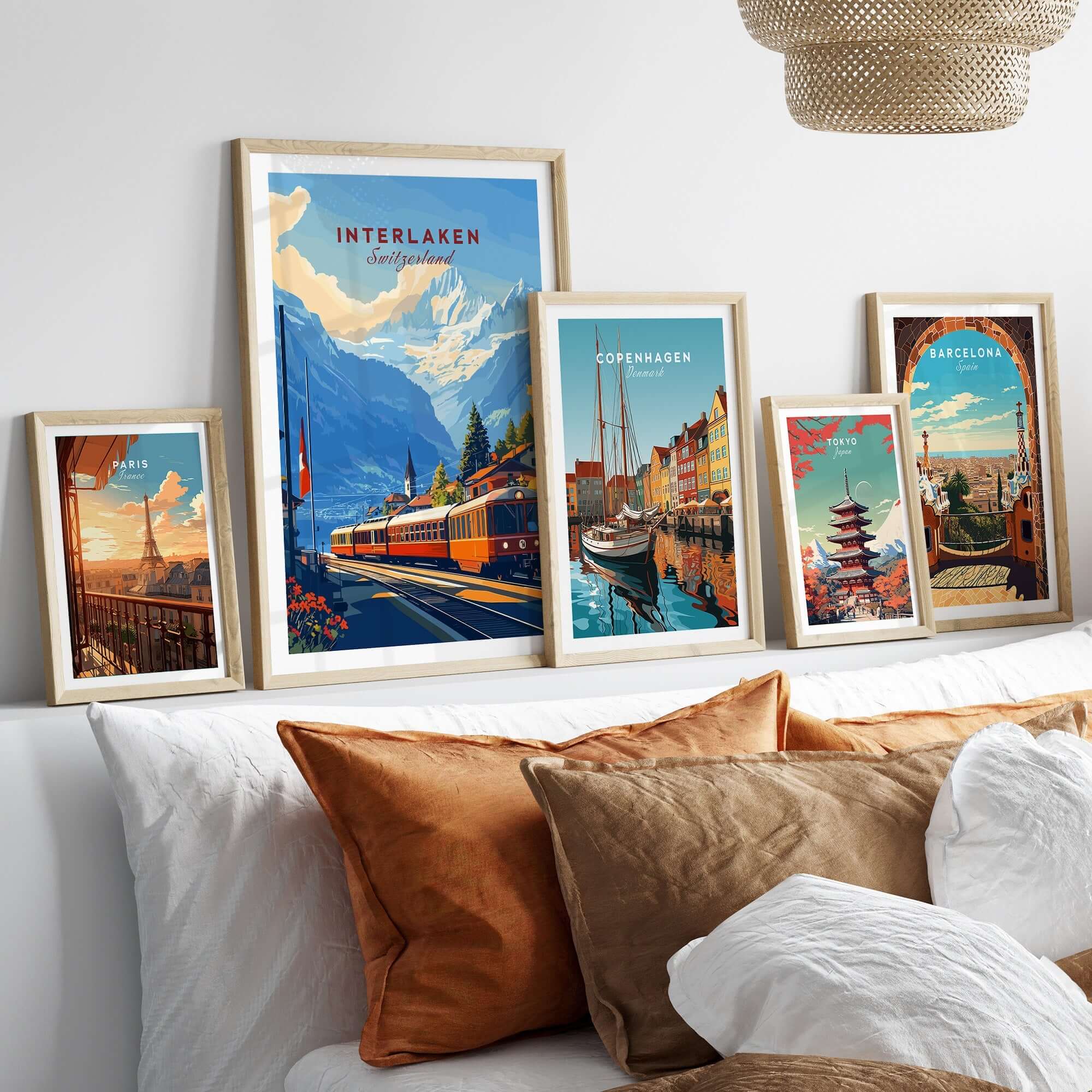 Interlaken Wall Art featuring beautiful landscape in frames on a cozy bed with pillows.