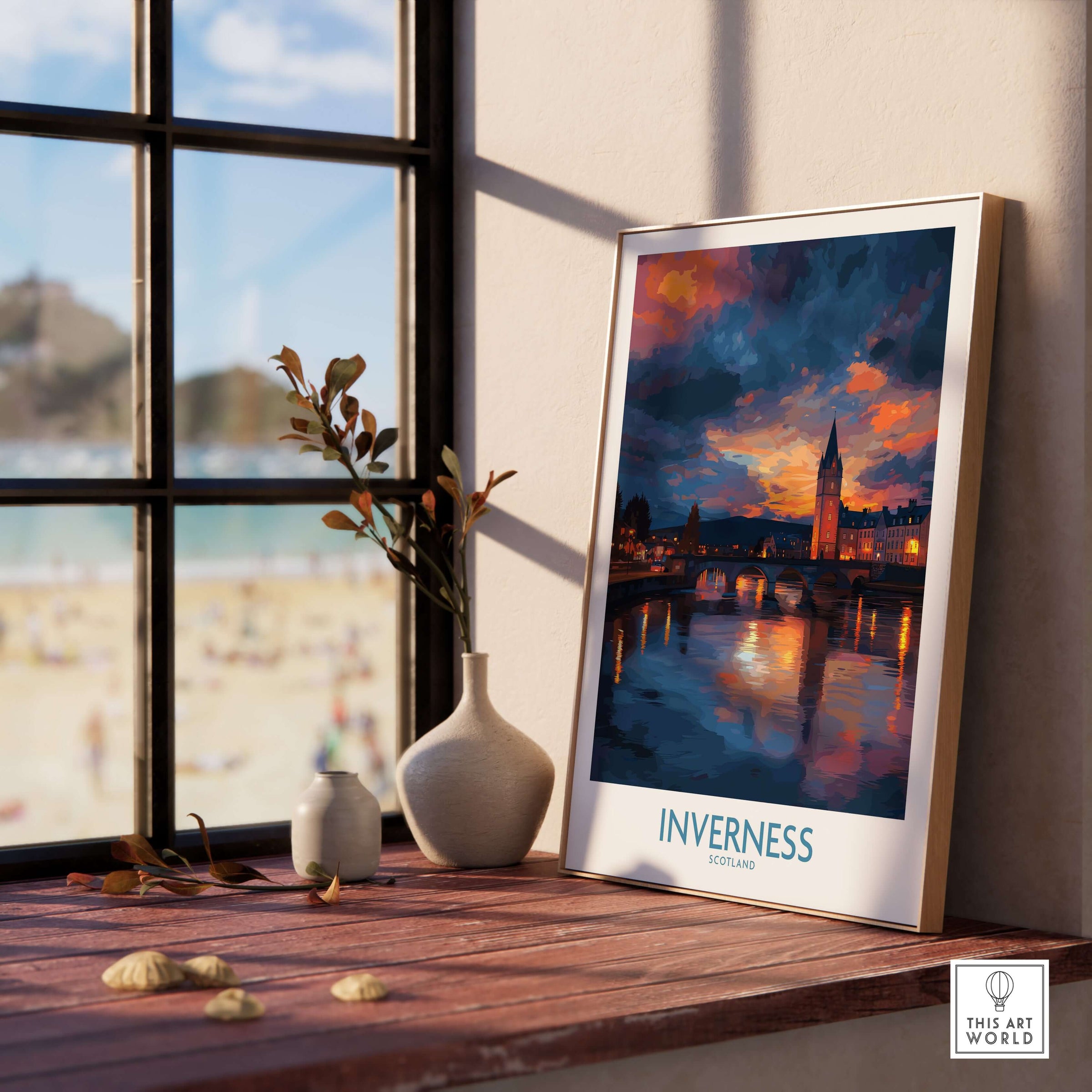Inverness Print | Highland Home Decor displayed on a wooden table near a window, showcasing Scotland's stunning landscapes.