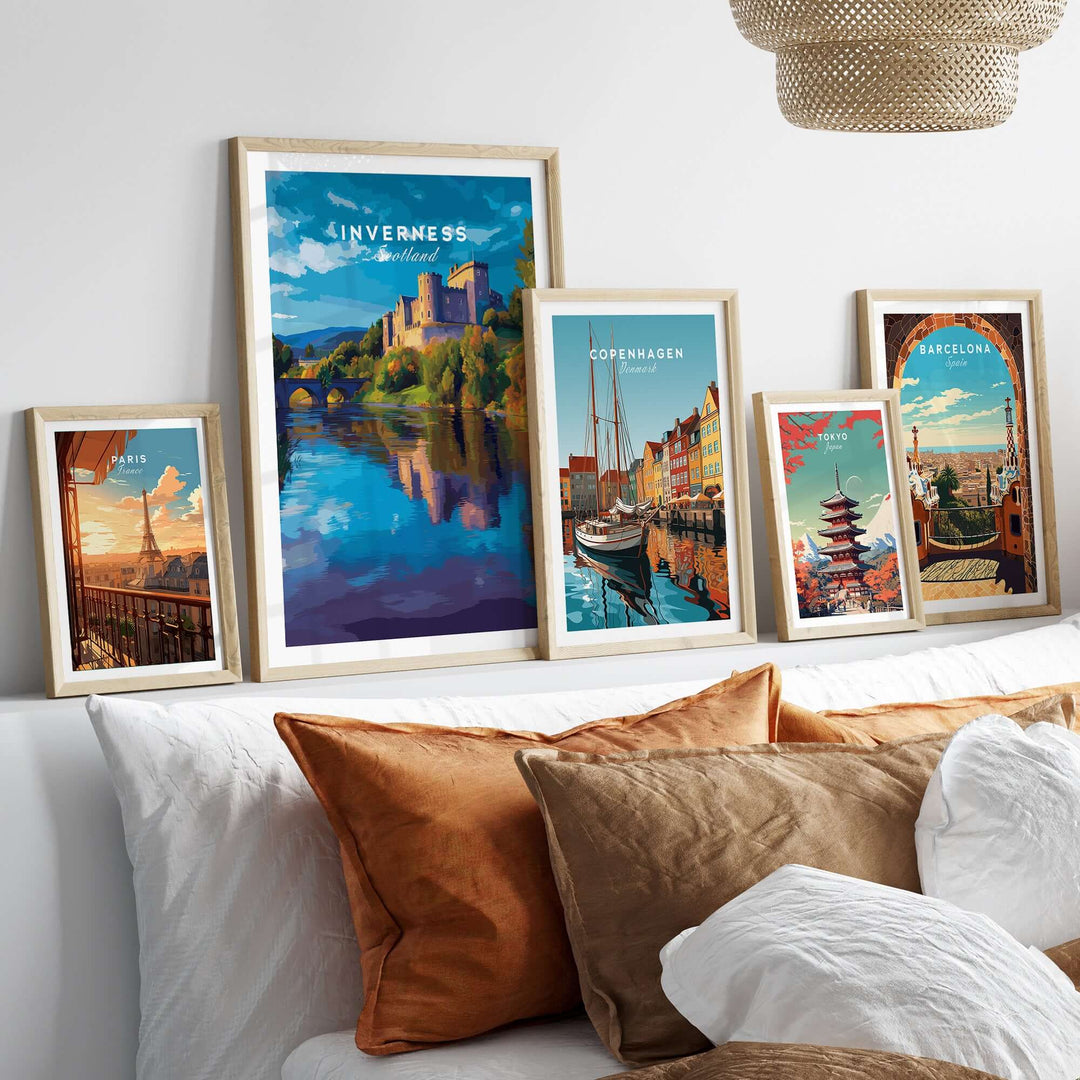 Inverness Print | Scottish Castle Wall Decor displayed among other city artwork on a stylish sofa.