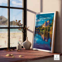 Inverness Print | Scottish Castle Wall Decor displayed on a windowsill with a scenic background.