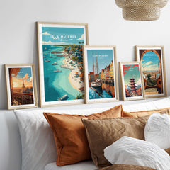 Isla Mujeres Beach Scene Poster - Mexico Tropical Wall Decor displayed among various travel posters on a cozy bed.