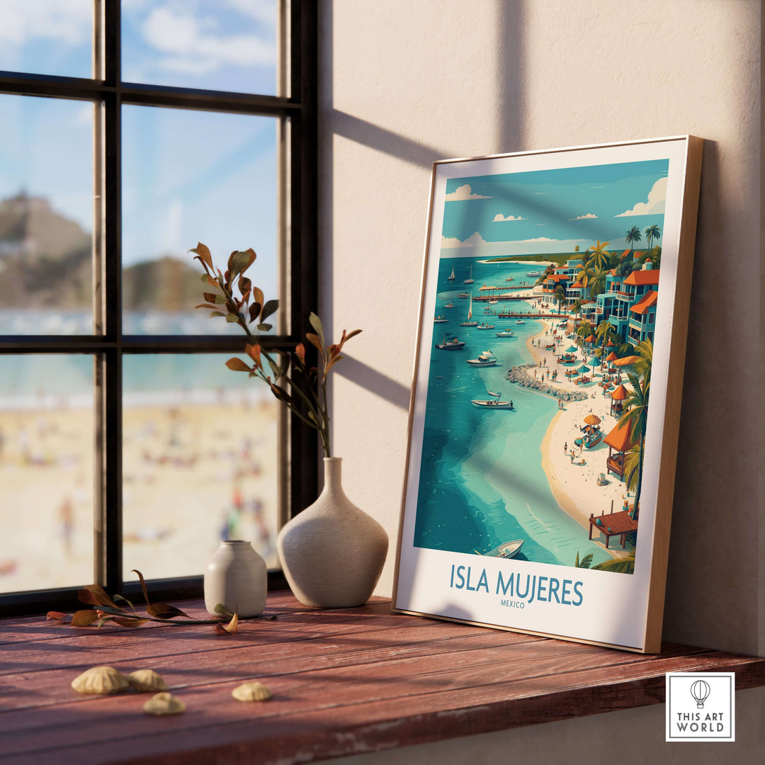 Isla Mujeres travel poster showcasing vibrant coastal town art, framed beside a sunny window.
