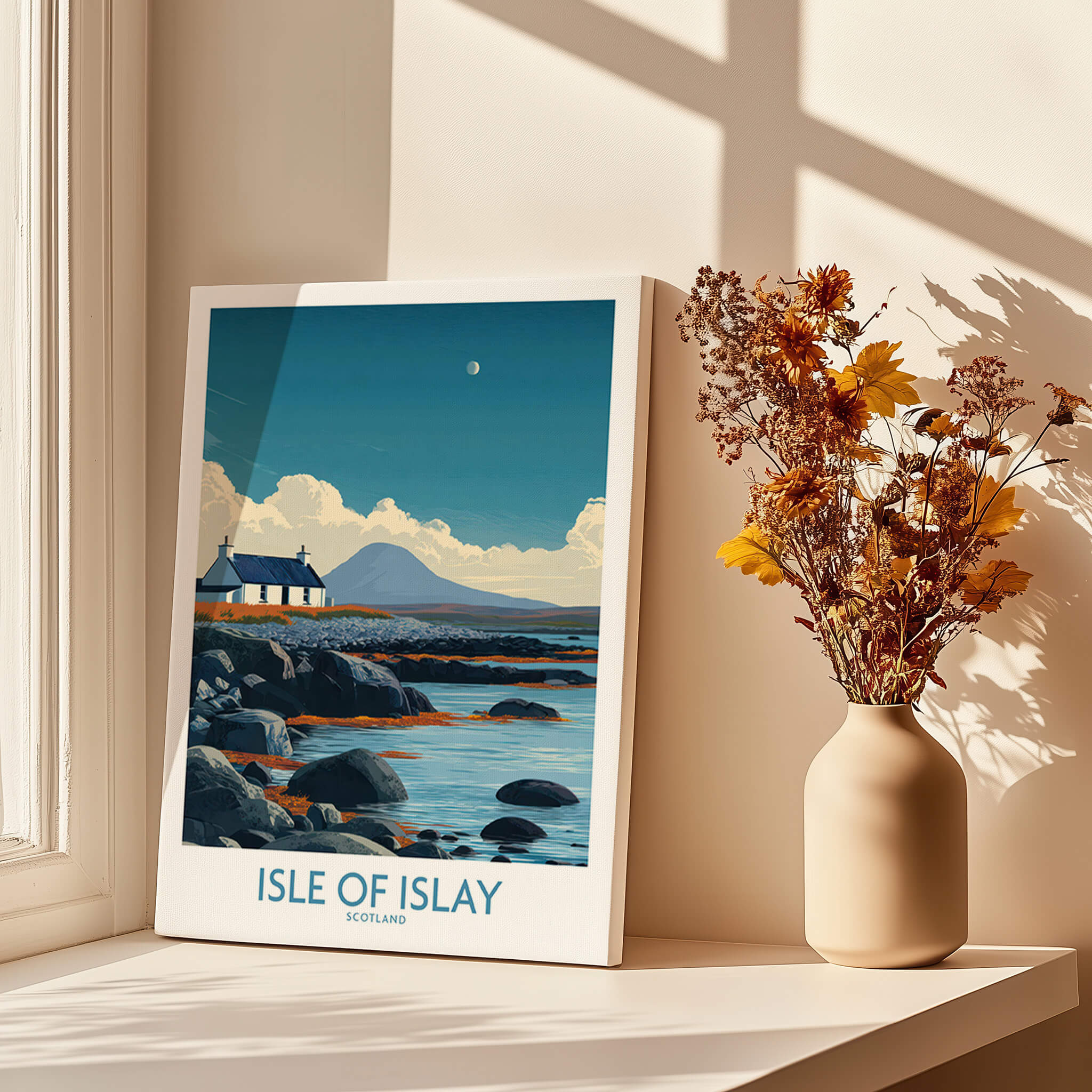 Isle of Islay Scotland Poster | Remote Scottish Coastal Scene Canvas Print in a sunny room with flowers and rocks.