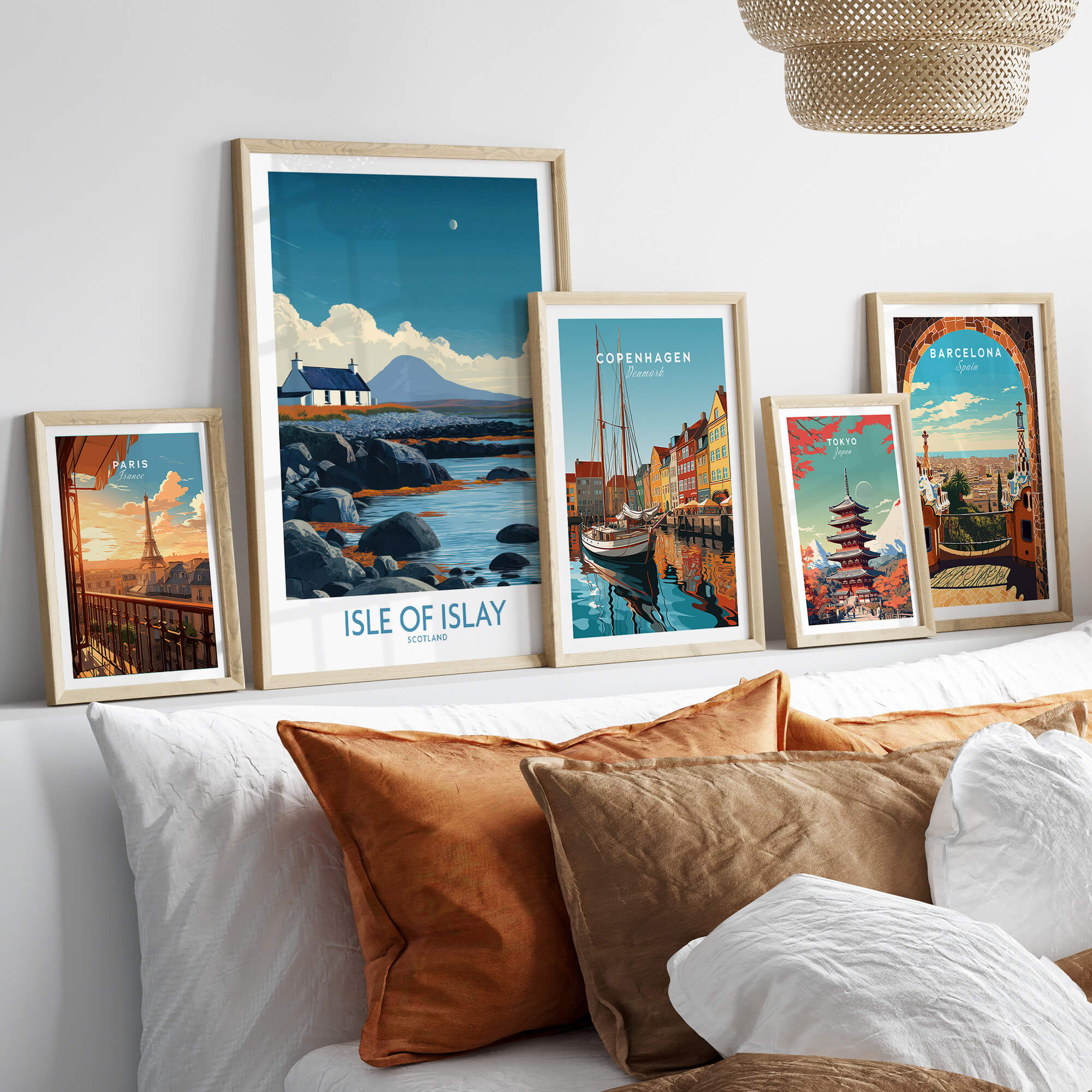 Isle of Islay Scotland Poster | Remote Scottish Coastal Scene Canvas Print displayed with other framed artworks on a stylish sofa.