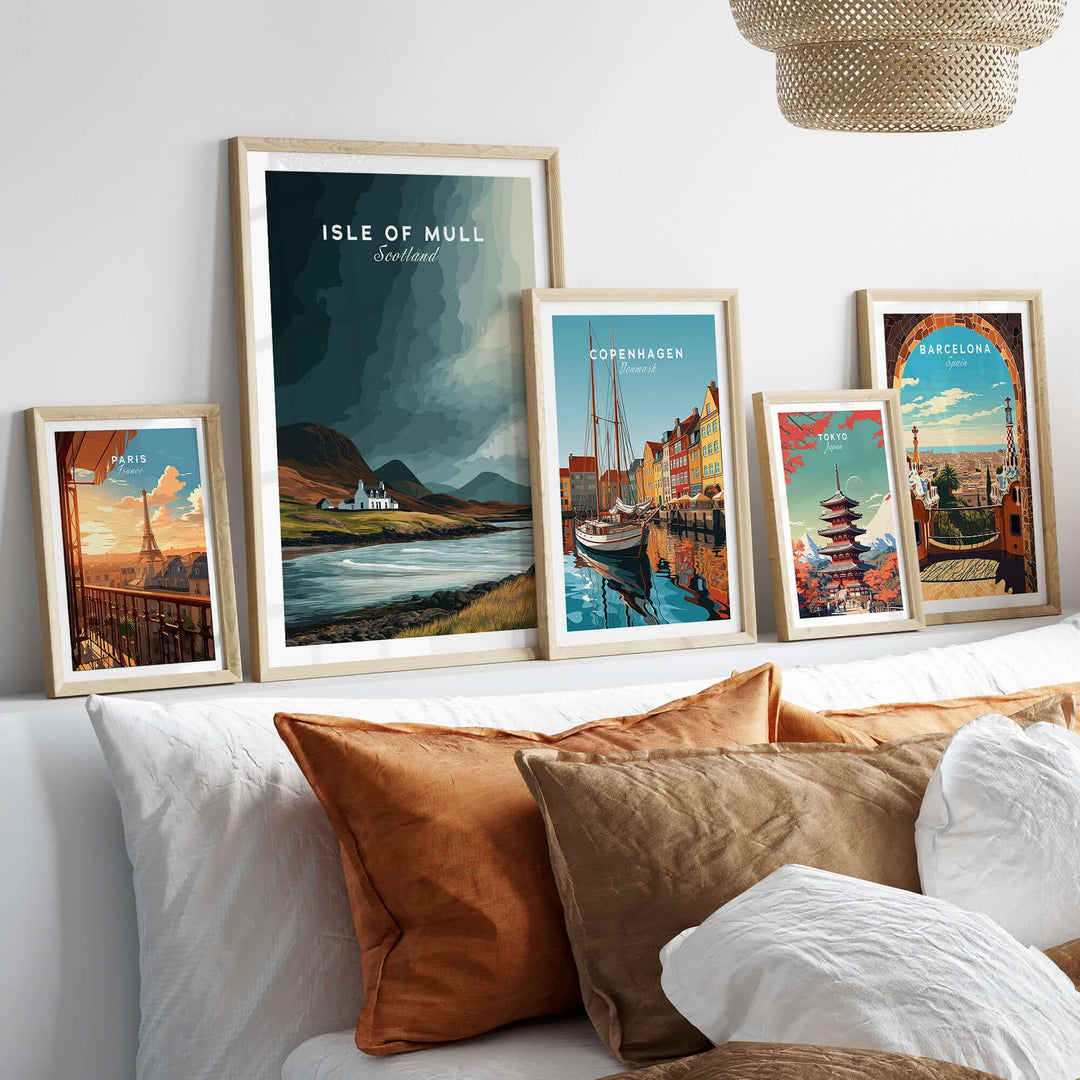 Collection of colorful framed prints including Isle of Mull, showcasing coastal cottage and cityscapes.