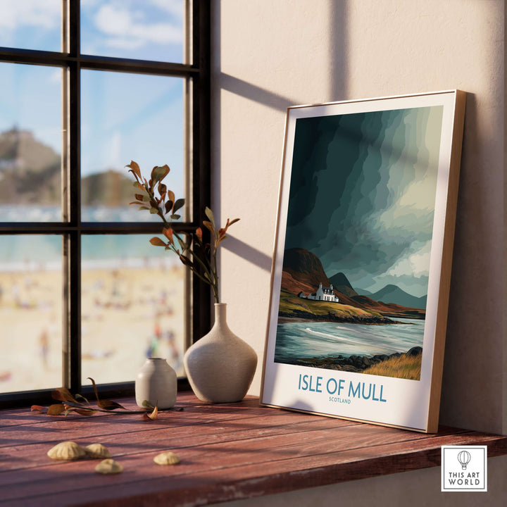 Isle of Mull Scotland landscape poster displayed in a home setting with beach view in background.