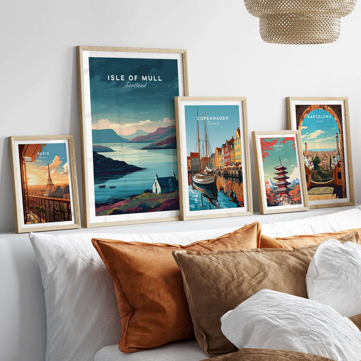 Isle of Mull poster and framed prints showcasing serene landscapes and vibrant cityscapes on a cozy couch.