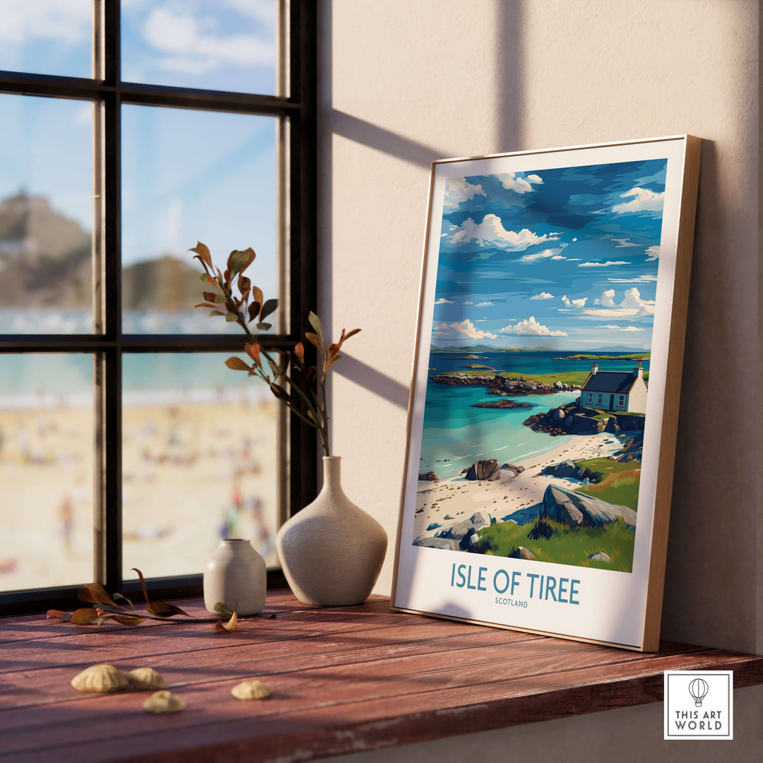 Isle of Tiree Scotland Print displayed on a wooden table with a serene beach view through the window.