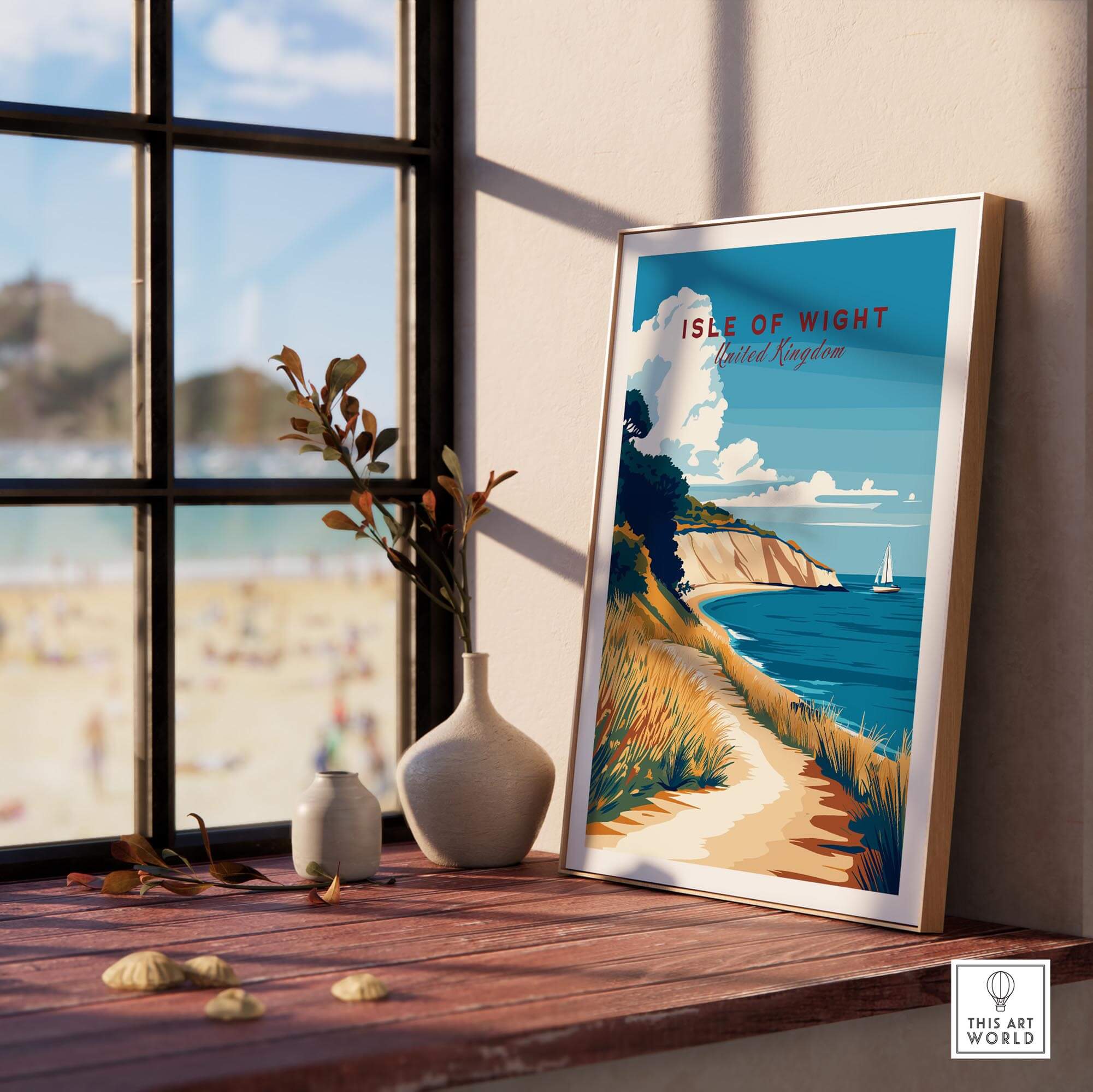 Isle of Wight England Travel Print beautifully framed and displayed by a window with a beach view.