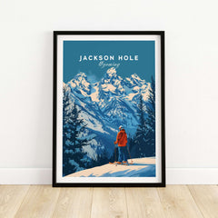 Jackson Hole Ski Poster featuring a skier overlooking snowy mountains in Wyoming, framed and displayed against a light wall.