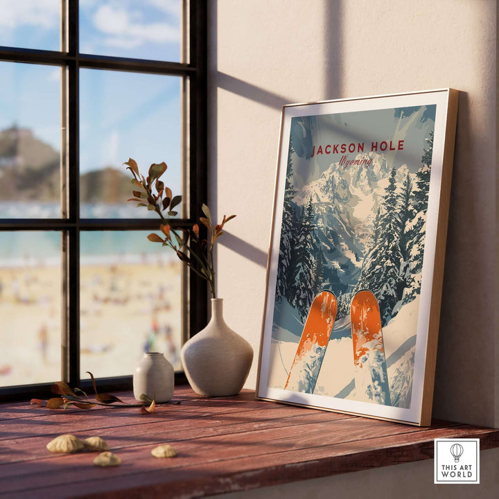 Jackson Hole travel poster showcasing ski slopes and scenic mountains, displayed on a table with sunlight streaming through a window.