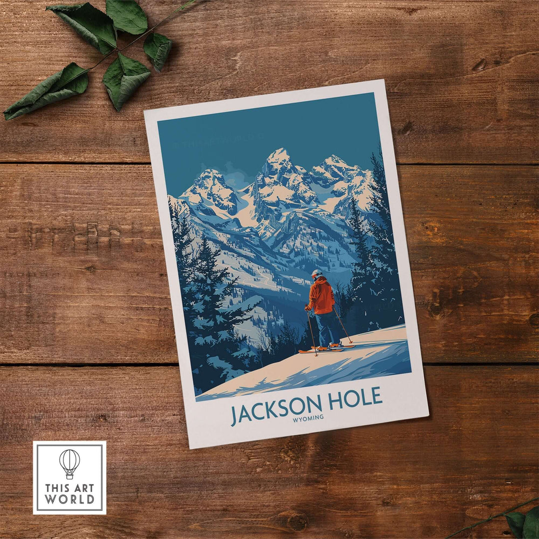 Jackson Hole Wall Art featuring a skier in a red jacket with snow-covered mountains in Wyoming background, on a wooden table.