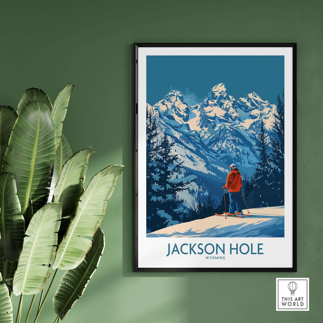 Jackson Hole Wyoming wall art with skier and mountain scene, framed and displayed on a green wall with plant nearby.