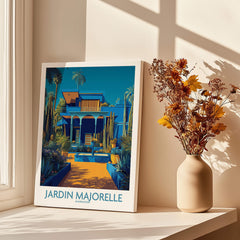 Jardim Majorelle Marrakech Posters | Majorelle Blue Architecture Canvas Print displayed on a sunny windowsill with flowers.