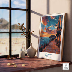 Jersey Channel Islands Sunset Art Print displayed in a cozy indoor setting with a beautiful coastal view.