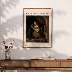Johannes Vermeer A Woman Feeding Parrot - Dutch Golden Age Art Print Poster showcased in a stylish interior setting.
