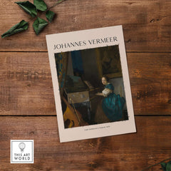 Johannes Vermeer Lady Seated at a Virginal 1670 Dutch Golden Age Art Print on a wooden table.