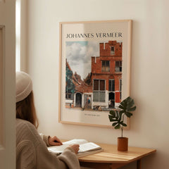 Johannes Vermeer The Little Street 1657 Delft Scene Dutch Golden Age Art Print displayed in a cozy room.