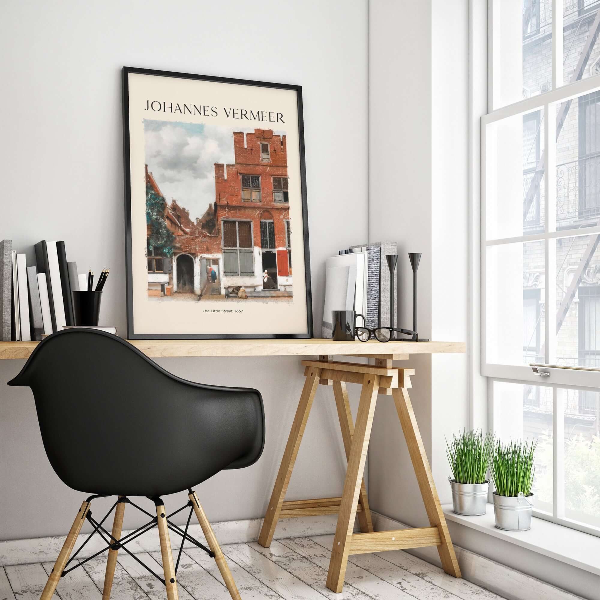 Johannes Vermeer The Little Street 1657 Delft Scene Dutch Golden Age Art Print framed on a desk in a modern interior.