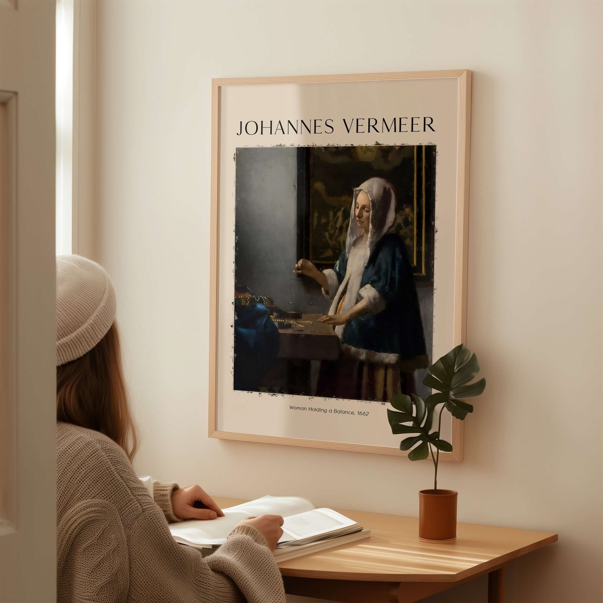 Johannes Vermeer Woman Holding a Balance 1662 Dutch Baroque Art Print Poster displayed in a cozy interior.