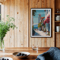 Kalamata Greece Travel Poster | Charming Street Wall Art Print displayed in a cozy interior with wooden walls and plants.