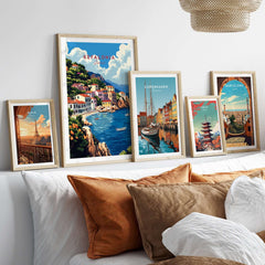 Kefalonia Art Print displayed among other travel posters on a modern sofa, showcasing vibrant landscapes.