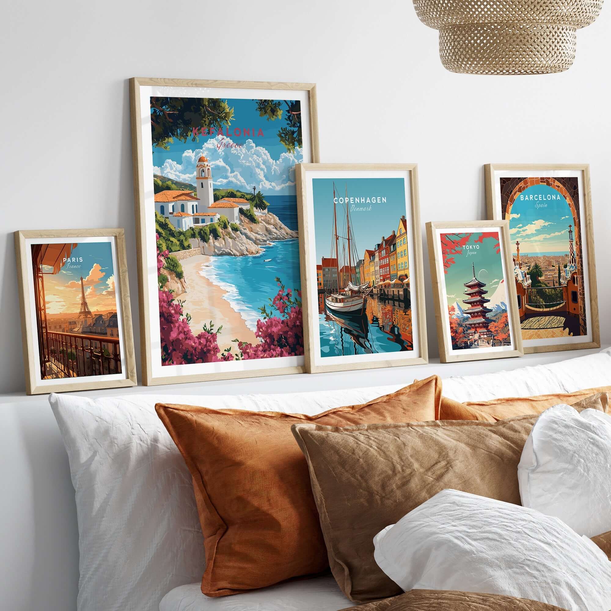 Kefalonia Wall Art Print showcasing Mediterranean landscapes in a stylish frame arrangement on a cozy bed.