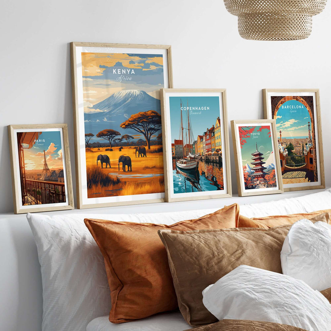Kenya Africa Elephant Safari poster framed, showcasing wildlife and mountains, alongside city prints on a cozy couch.