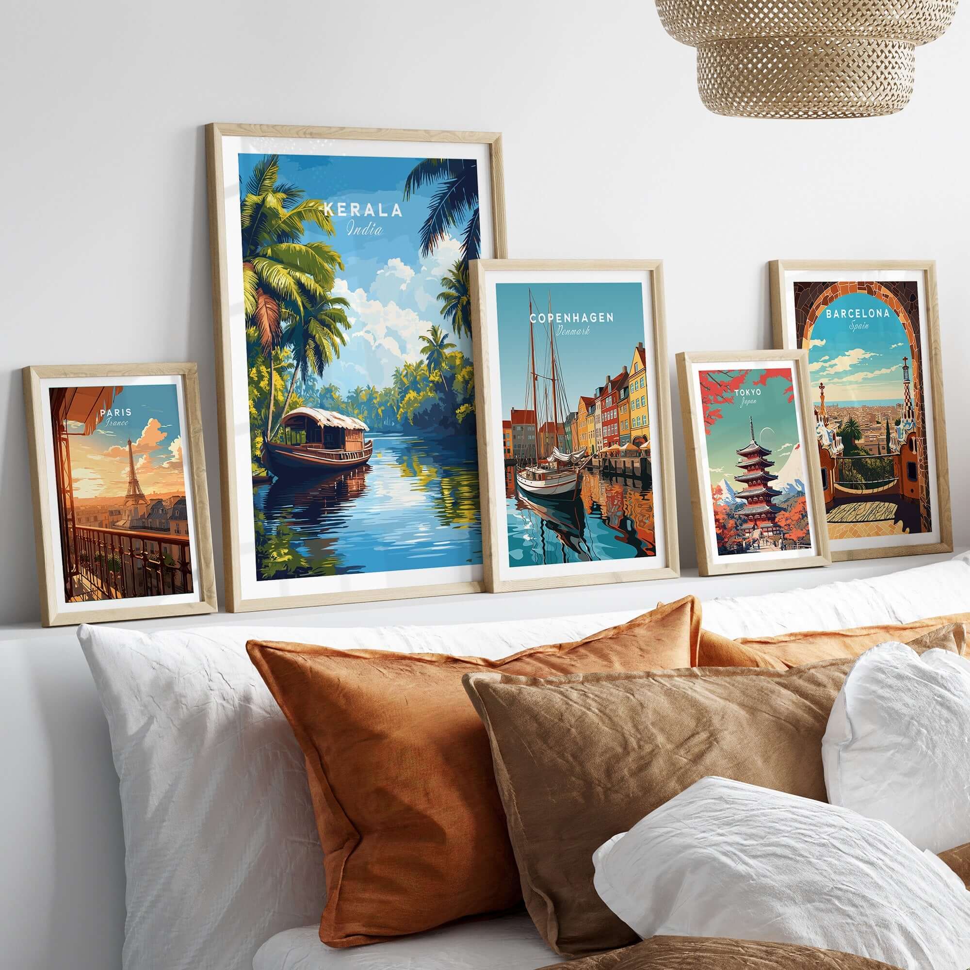 Kerala Wall Art India displayed in stylish frames above a cozy sofa with decorative cushions.