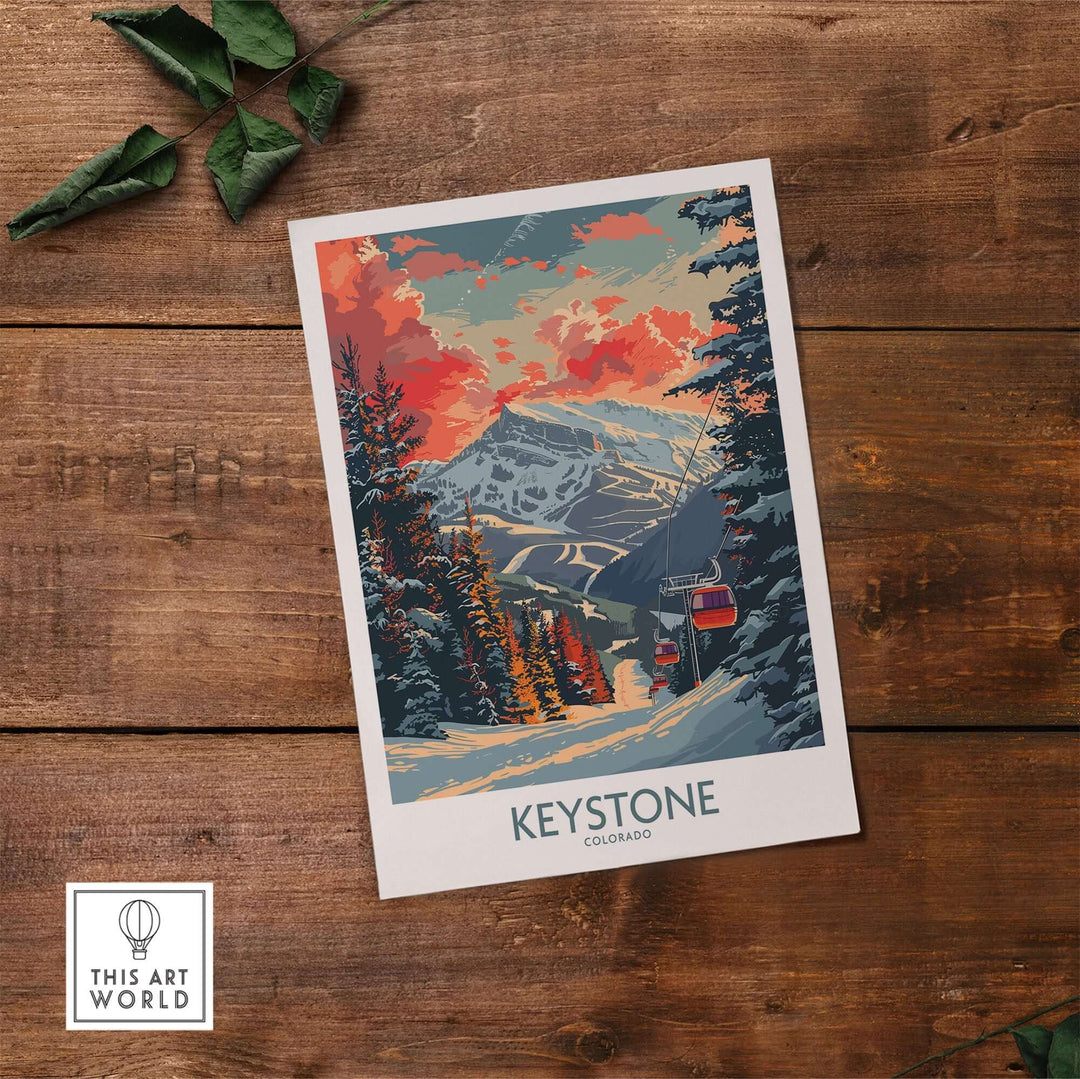 Vintage-style Keystone Colorado poster featuring a snowy mountain landscape with vibrant sky, displayed on a wooden surface.