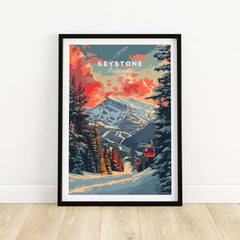 Keystone Print featuring a snowy Colorado mountain scene with trees and a ski lift, set against a vibrant sunset sky.