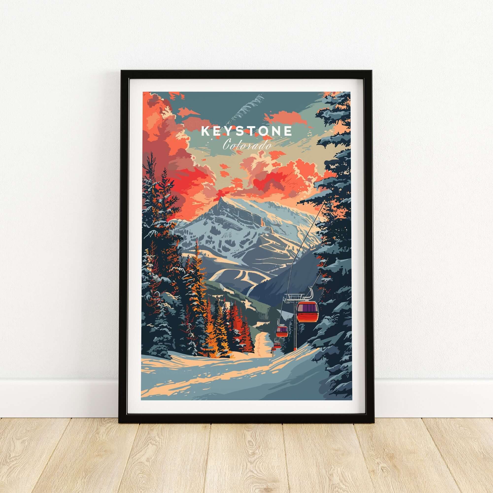 Keystone Print featuring a snowy Colorado mountain scene with trees and a ski lift, set against a vibrant sunset sky.