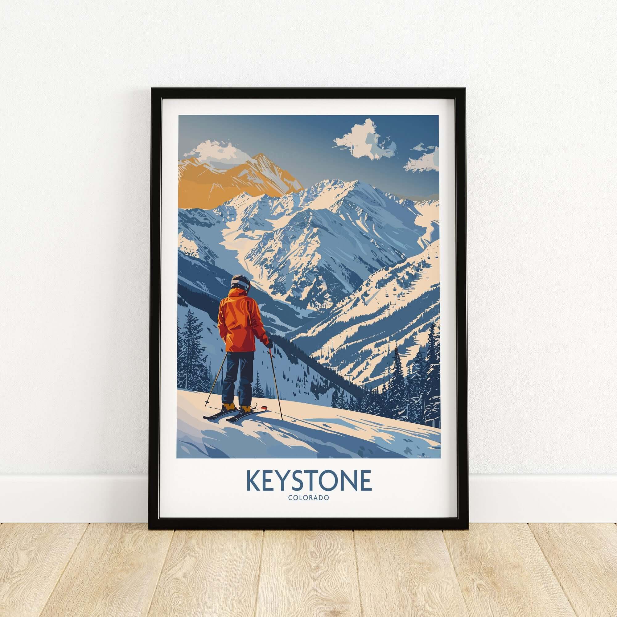Keystone Ski Print showcasing a skier in an orange jacket against Colorado's majestic mountain landscape.