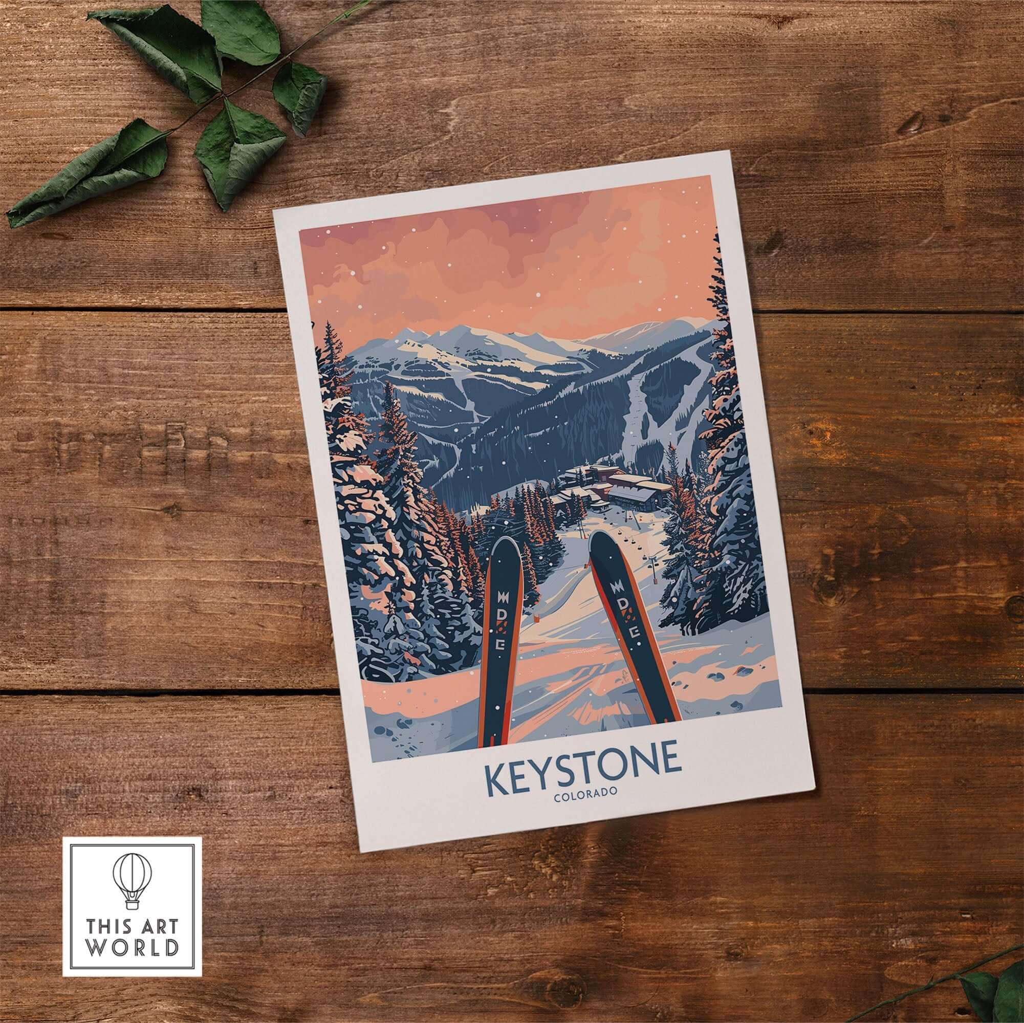 Keystone Wall Art - Colorado Ski Poster on wooden background with green leaves, capturing a snowy mountain scene.