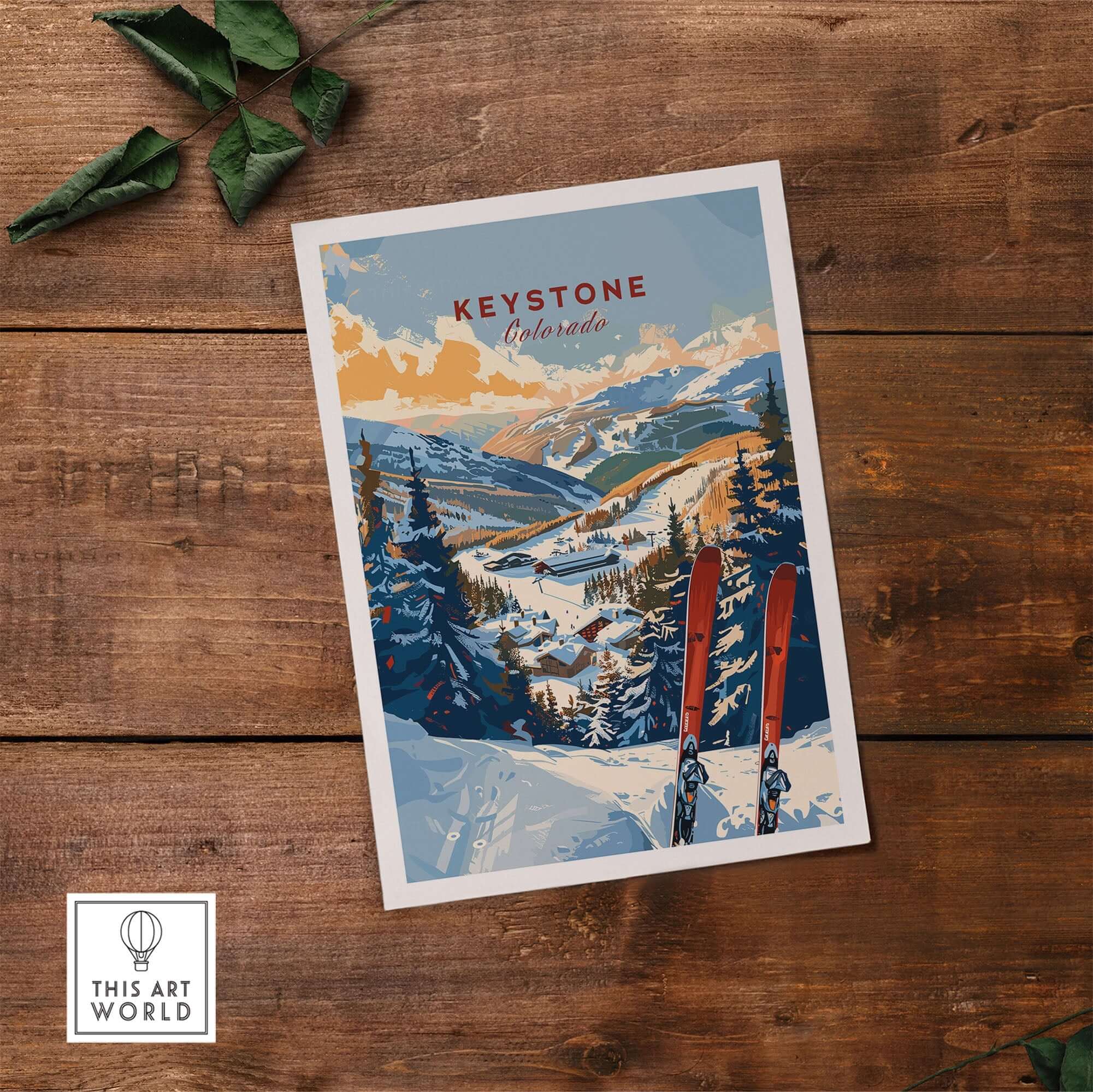 Keystone Colorado ski wall art print on wooden table, featuring snowy mountain landscape and vibrant winter colors.