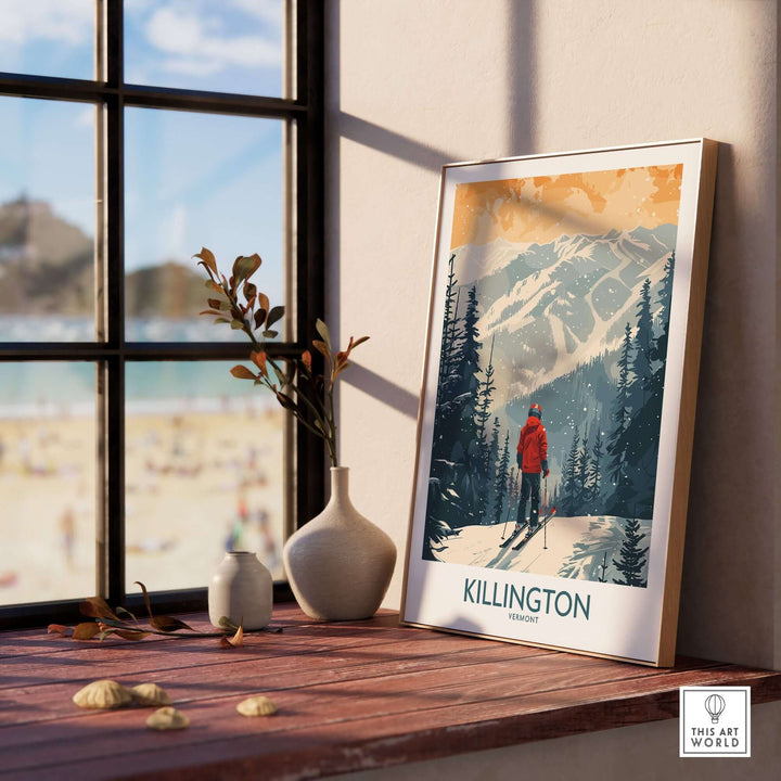 Vintage-style Killington Vermont poster featuring a skier in a snowy mountain landscape, displayed on a sunny windowsill with decorative vases.