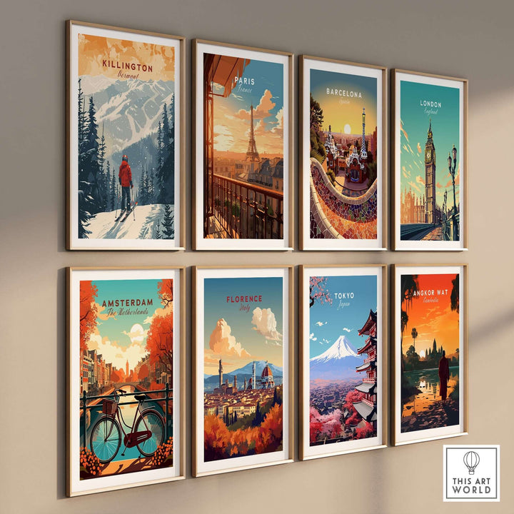 Gallery wall featuring travel-themed art prints, including Killington print from Vermont, Paris, Barcelona, London, Amsterdam, Florence, Tokyo, and Angkor Wat.