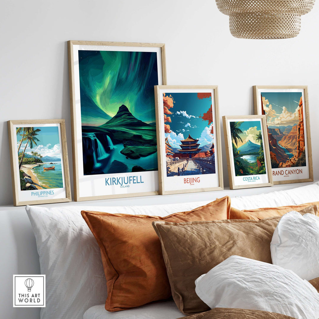Kirkjufell Iceland Art Print | Waterfall Poster displayed among other travel-themed art prints on a stylish shelf.