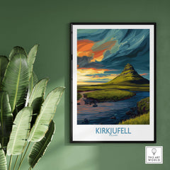 Kirkjufell Iceland Print | Dramatic Sunset River Poster displayed on a green wall with plants.