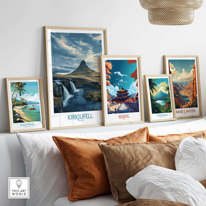 Kirkjufell Iceland Waterfall Mountain Art Print displayed among other travel-themed art prints on a cozy shelf.