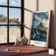 Kirkjufell Iceland Waterfall Mountain Art Print displayed in a bright room with a scenic view and cozy décor.
