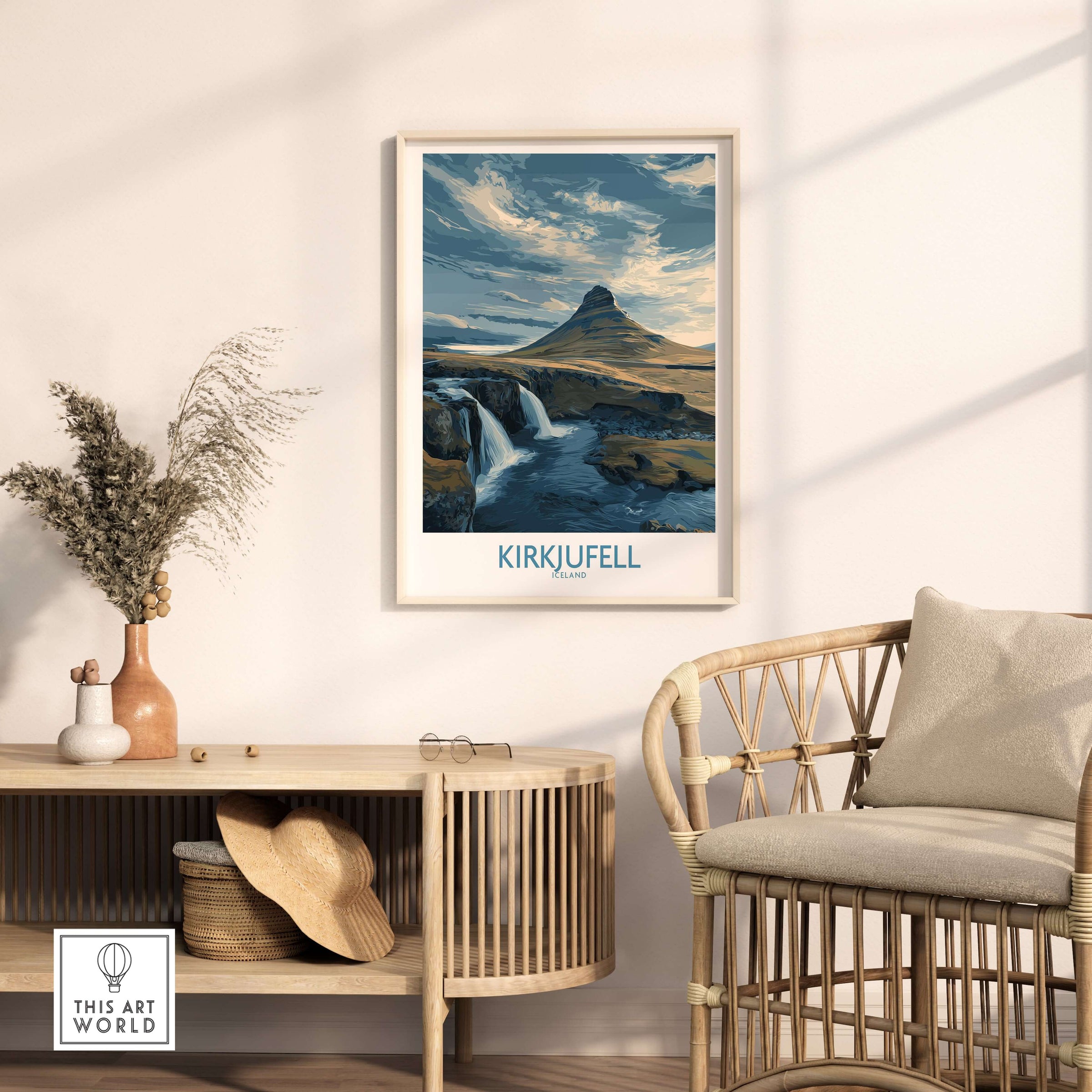 Kirkjufell Iceland Waterfall Mountain Art Print displayed in a modern interior with a chair and decor items.